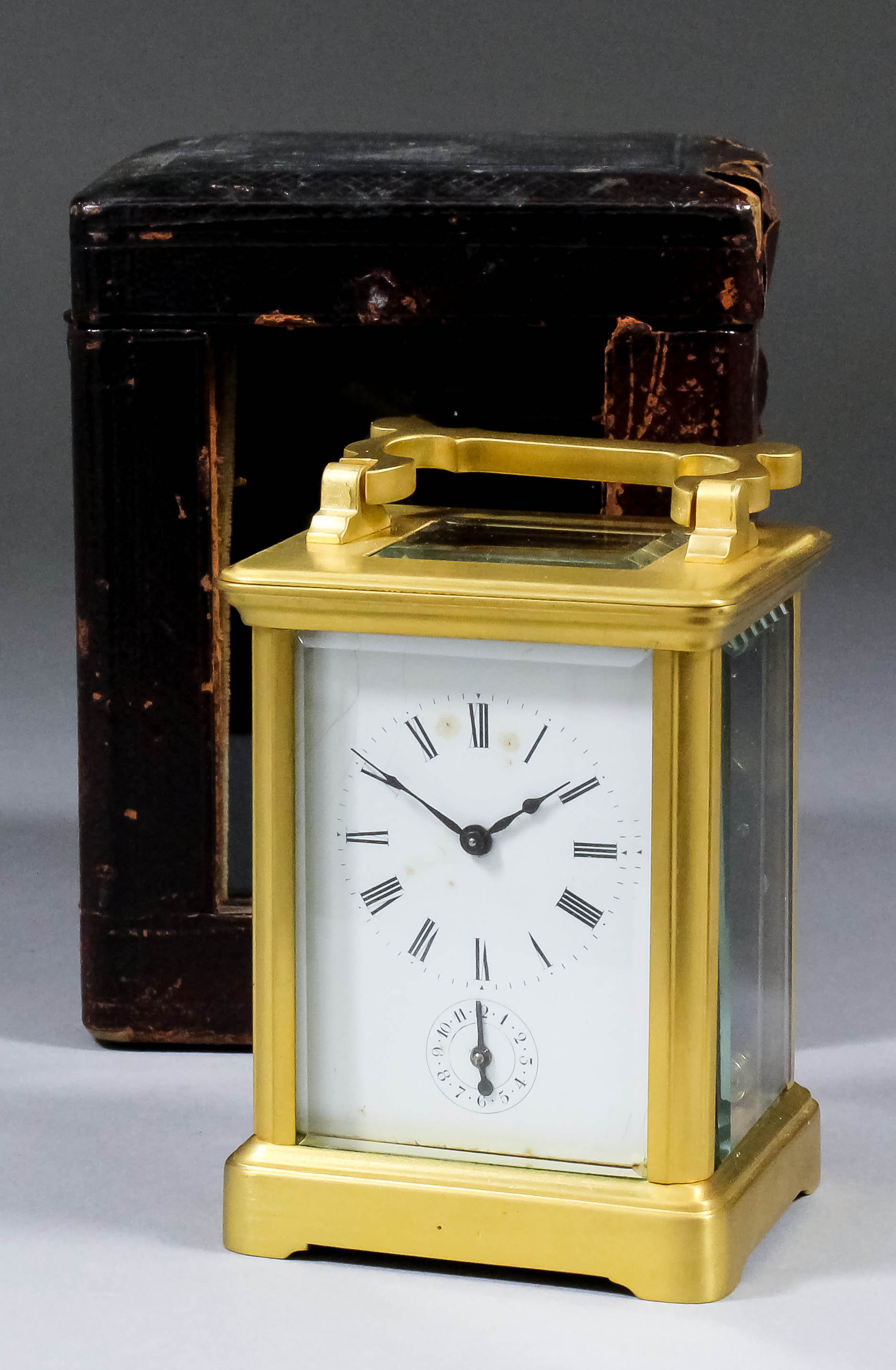 A late 19th Century French miniature carriage timepiece with alarum, the white enamel dial with