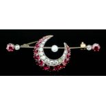 A late Victorian gold coloured metal mounted ruby and diamond set crescent pattern bar brooch set