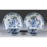 Two Worcester blue and white porcelain tea bowls and saucers with fluted sides, decorated with "