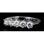 A modern 18ct white gold five stone diamond ring, the brilliant cut stones each approximately .