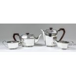 An Edward VIII silver four piece tea service, the plain hexagonal bodies with cast angled mounts and