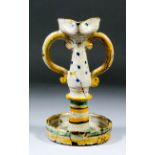 A 17th/18th Century Italian lead-glazed two-handled standing oil lamp painted with bands and dots,
