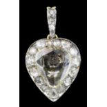 A late Victorian gold and silvery coloured metal mounted all diamond set heart pattern pendant,
