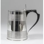 A George III silver lidded tankard of cylindrical tapered form, with reeded band to lid and twin