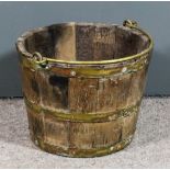 A 19th Century brass bound coopered bucket with bale handle, 10ins high