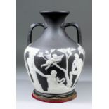 A 19th Century Wedgwood black Jasperware Portland vase, the replacement base with the head of