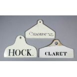 An English creamware wine bin label of coat-hanger form, the top pierced for suspension, named in