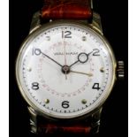 A modern gentlemen's 14k gold cased Waltham bubble back wristwatch, model No. 32372410, the white