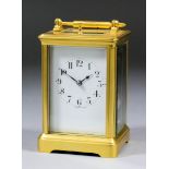 A late 19th/early 20th Century French carriage clock, the white enamel dial with Arabic numerals, to