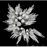 A 1980's G. Weil 18ct white gold and platinum mounted all diamond set stylised starburst pattern