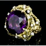 A 1980's gold coloured metal mounted amethyst and diamond ring, the circular cut amethyst 23mm