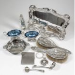 An Edward VII silver rectangular tray of Art Nouveau design and of shaped outline, with scroll