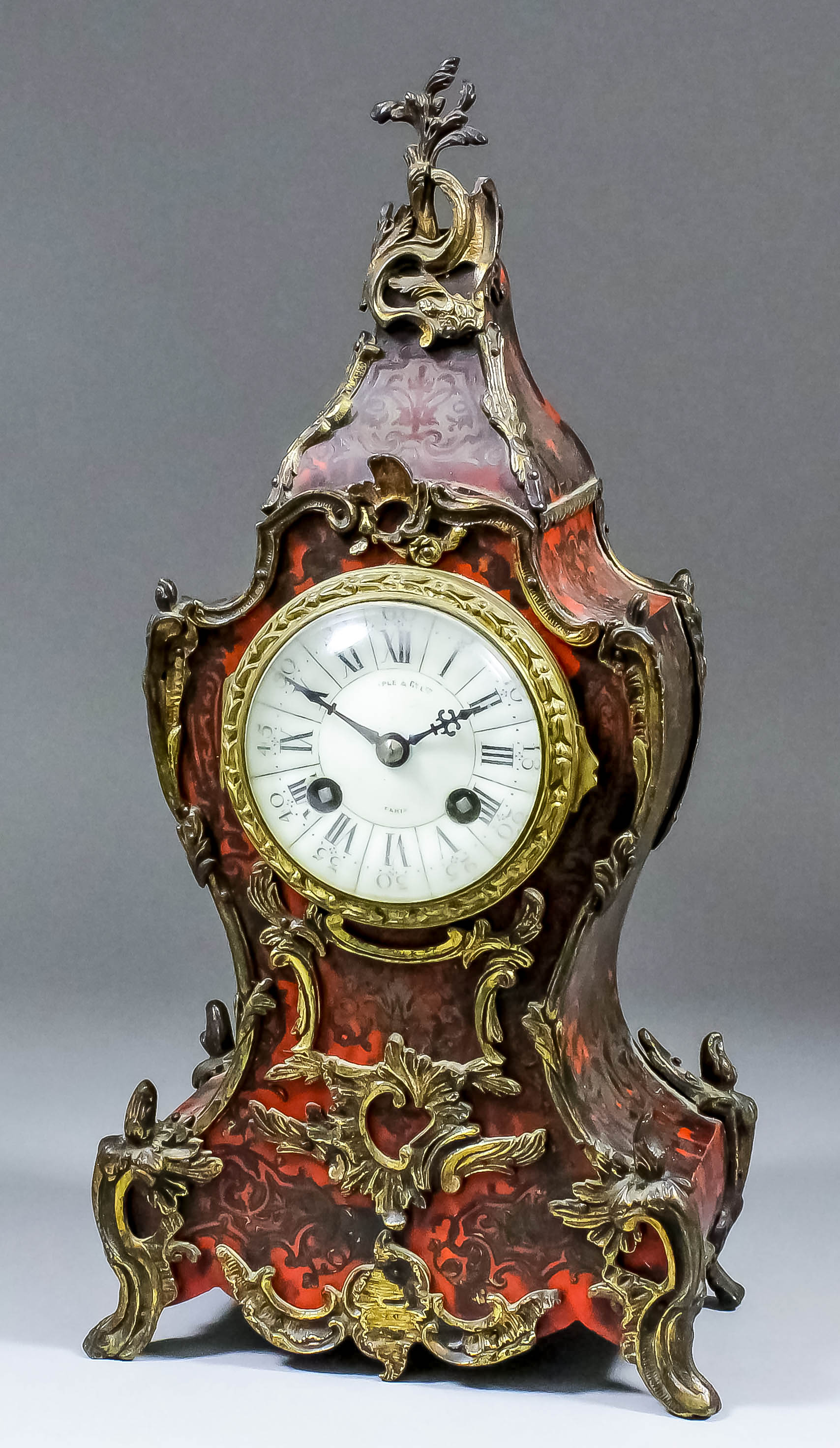 A late 19th Century French red tortoiseshell Boulle and gilt brass mounted mantle clock by Maple and