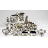 A Victorian silver Christening mug, the urn-shaped body embossed with a romantic wooded landscape,