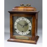 A mid-20th Century English walnut cased mantel clock of "17th Century" design, the 6ins square brass