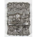 A rare Victorian silver rectangular "Castle Top" card case of shaped outline, the front cast in high