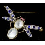 A late Victorian gold coloured metal mounted moonstone, sapphire, diamond and ruby set dragonfly