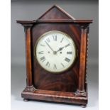 A mahogany mantel clock in the Victorian manner, the 7.75ins diameter painted metal dial with