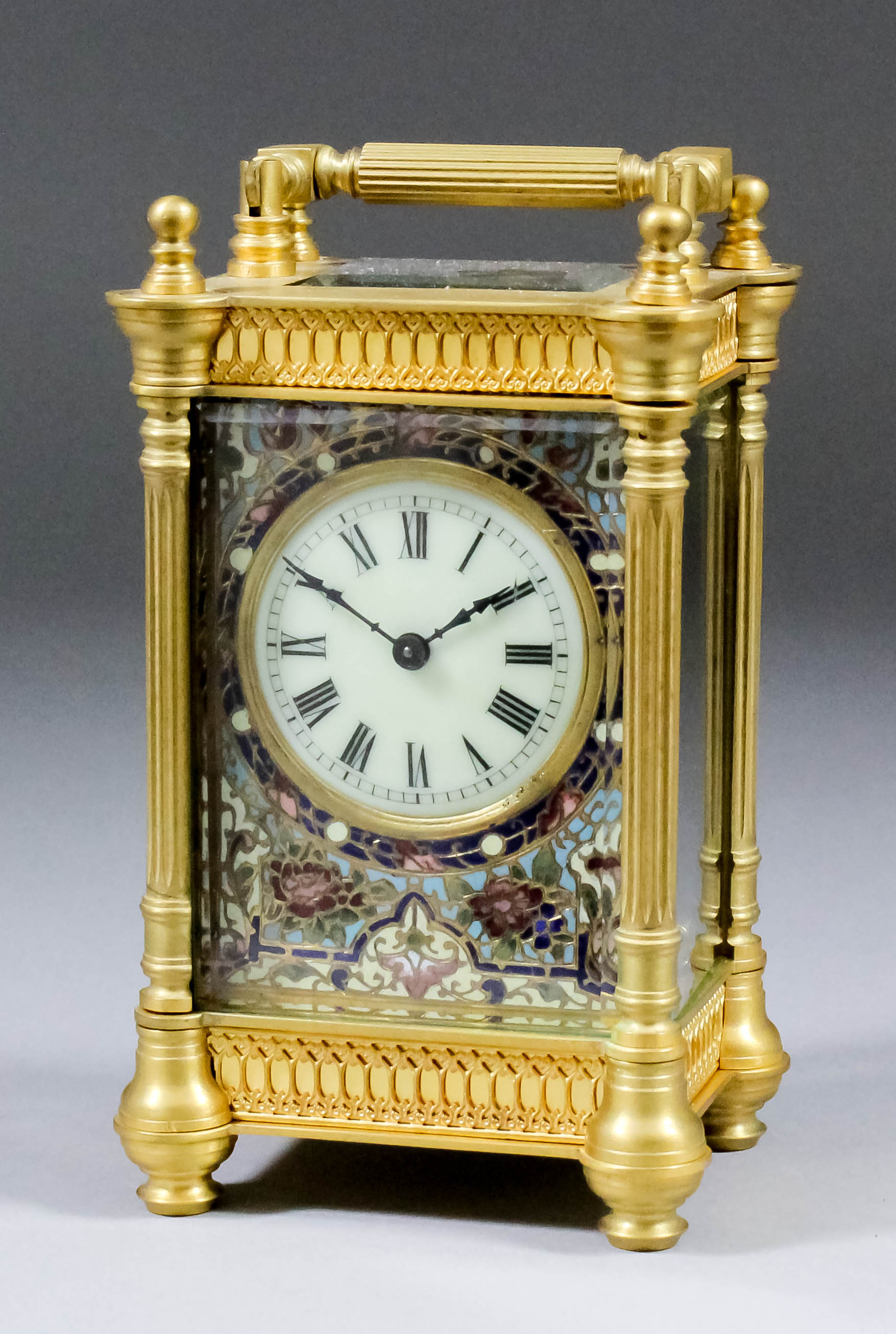 A late 19th/early 20th Century French carriage timepiece, the 1.75ins diameter cream enamel dial