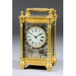 A late 19th/early 20th Century French carriage timepiece, the 1.75ins diameter cream enamel dial