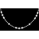 A modern 18ct white gold and all diamond set necklace set with four panels of two tear drop and