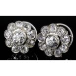 A pair of modern gold and silvery coloured metal mounted all diamond set flowerhead pattern earrings