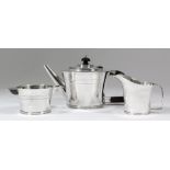 A George V and George VI harlequin silver circular three piece tea service of tapered form, with