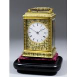 A late 19th Century French carriage clock, the 2.125ins diameter white enamel dial with Roman