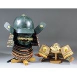 A late 20th Century Samurai helmet and mempo, finished in green paintwork with multicoloured