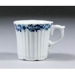 An early Worcester blue and white porcelain cup of fluted form, the upper rim painted with band of