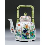 A Continental porcelain wine kettle in the "Japanese kakiemon" manner, the moulded body enamelled in
