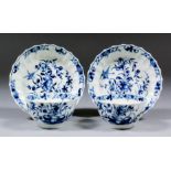 Two Worcester blue and white porcelain tea bowls and saucers with fluted sides, decorated with "