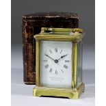 A late 19th/early 20th Century French miniature carriage timepiece, the white enamel dial with Roman
