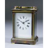 An early 20th Century French carriage timepiece, the white enamel dial with Roman numerals, to the