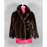 A 1960's lady's dark brown ranch mink jacket with fold back collar and black silk lining, size 12-