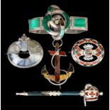 A Scottish silvery coloured metal mounted anchor pattern brooch set with six different coloured