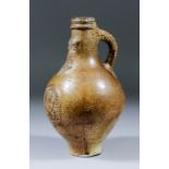 A 17th Century German salt glazed stoneware Bartmannkrug (Bellarmine) of small proportions,