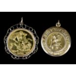 An Elizabeth II 1974 Sovereign in 9ct mount (gross weight 9.6 grammes) and a 9ct St. Christopher