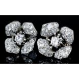 A pair of French silvery coloured metal mounted all diamond set flowerhead pattern earrings, the