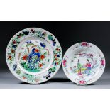 A Chinese "Famille Verte" porcelain circular plate enamelled in colours with flowering branches,