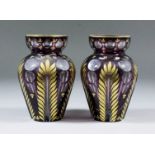A pair of Bohemian purple flashed and gilt decorated vases, each 6ins high