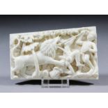 A 19th Century Indian ivory panel, the whole deeply carved with a lion hunt, 2.75ins (7cm) x 4.25ins