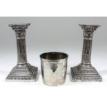 A pair of Victorian silver pillar candlesticks with gadroon mounts, Corinthian columns and on square