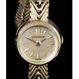 A lady's 14ct gold cased Jaeger Le Coultre wristwatch, the gilt dial with baton numerals in plain