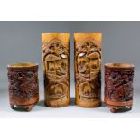 A pair of Chinese bamboo brush pots carved with figures in pavilioned garden landscapes, each