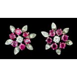 A pair of 1960's silvery coloured metal mounted ruby and diamond set flowerhead pattern earrings (