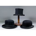 A black bowler hat by G.R. Dunn & Co Ltd., a black Homburg hat by Dunn & Co, and a black silk