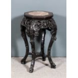 A Chinese hardwood octagonal jardiniere stand with pink veined marble slab to top and beaded to