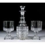 A pair of early 19th Century straight-sided and panel cut glasses, on square lemon squeezer feet,