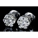 A pair of modern 18ct white gold mounted all diamond set flowerhead pattern earrings (for pierced